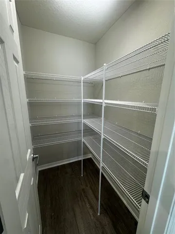a storage room with wooden floor