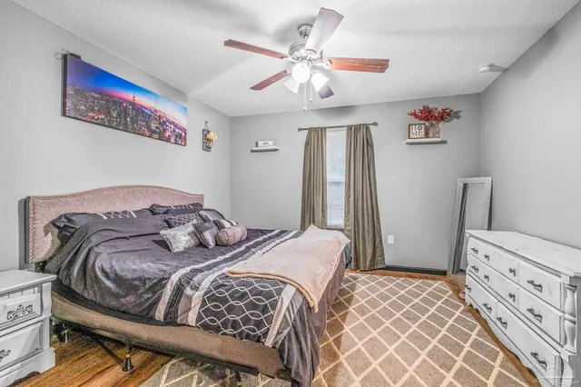 a bedroom with a bed and a cabinets