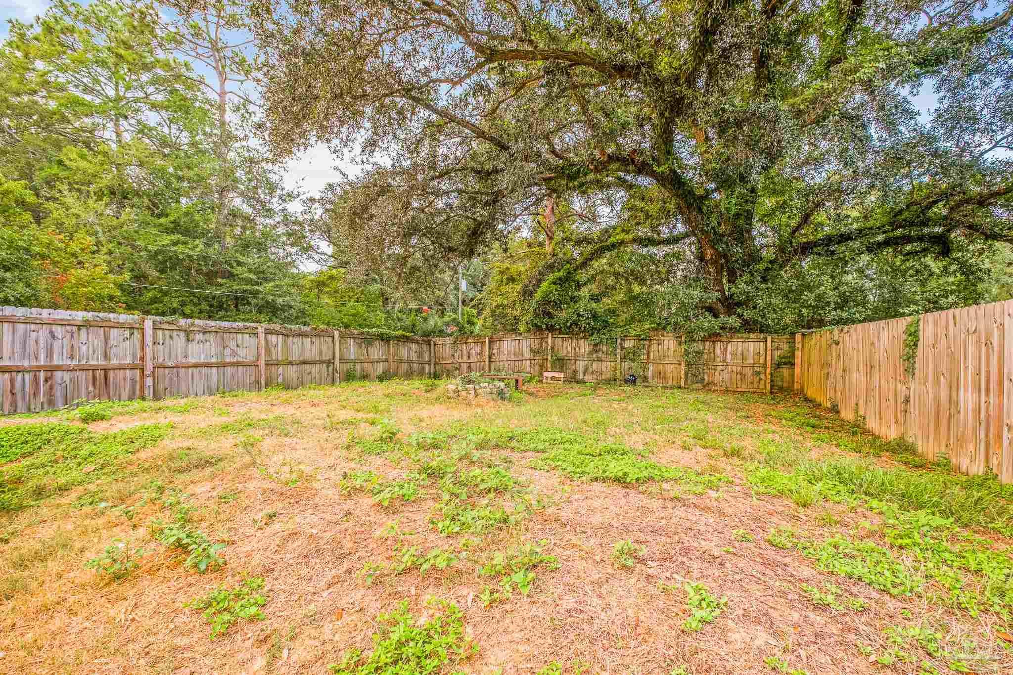 1827 Gainer Avenue Baker, FL 32531 - Photo 30 of 30 a view of yard with swimming pool and wooden fence