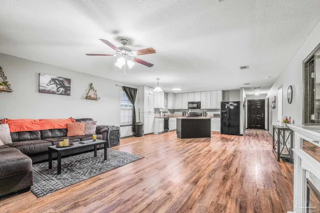 a open kitchen with a table and chairs