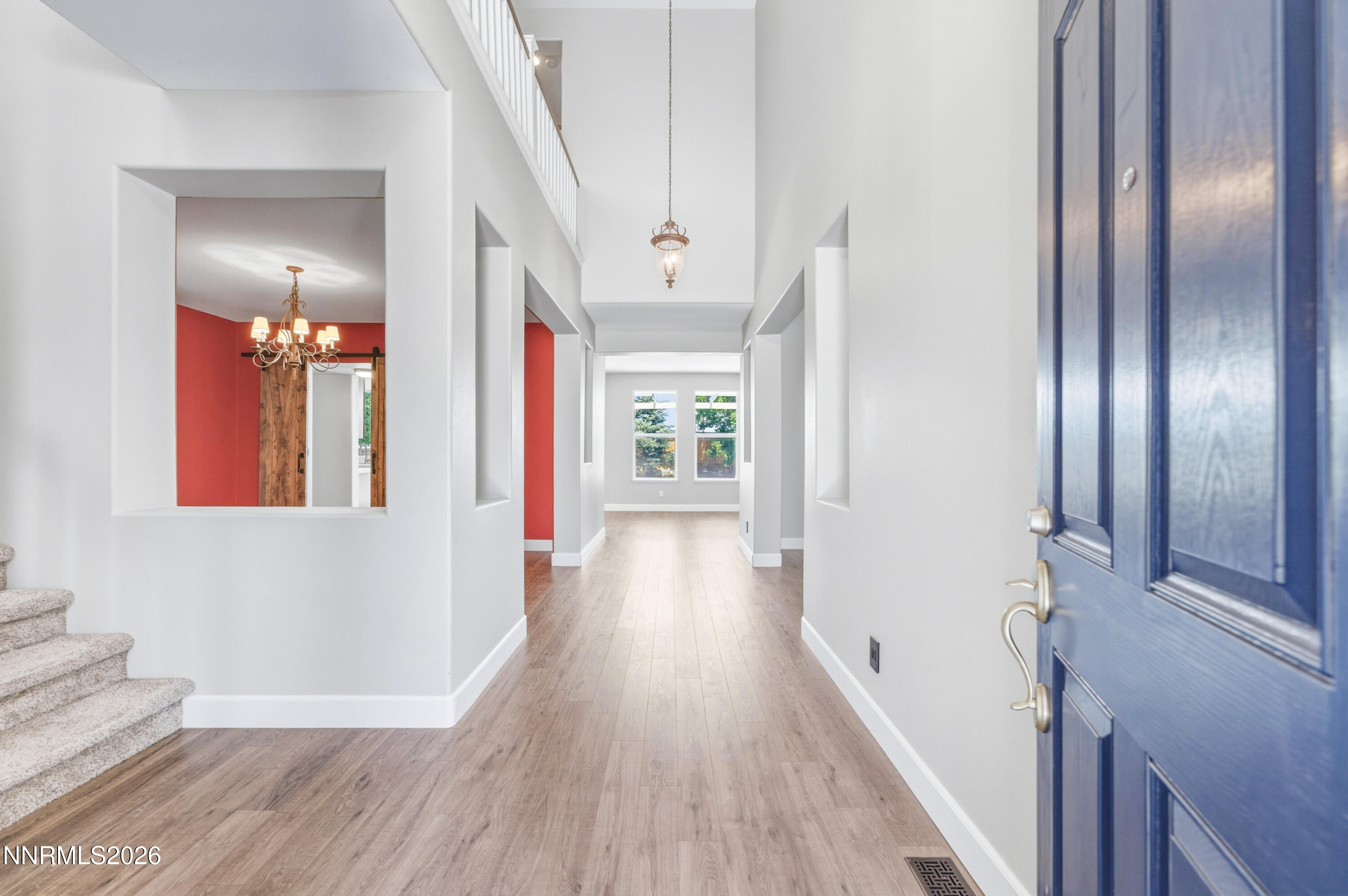 1770 Kodiak Circle Reno, NV 89511 - Photo 3 of 32 a view of a hallway with wooden floor and staircase