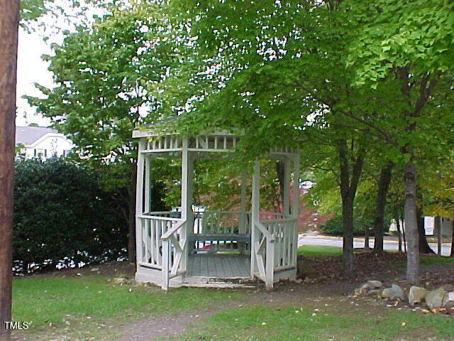243 Schultz Street Chapel Hill, NC 27514 - Photo 20 of 21 a view of a deck with a big yard and large trees