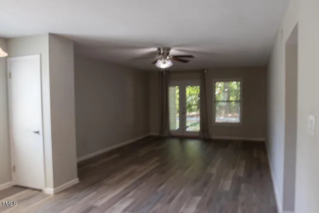 a room that has a window and wooden floor