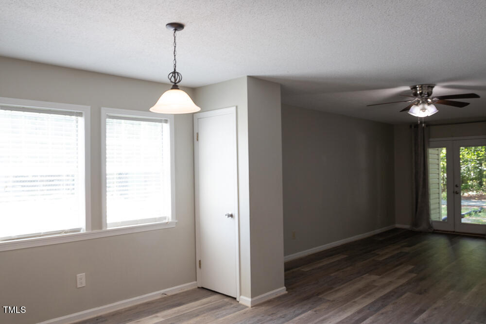 243 Schultz Street Chapel Hill, NC 27514 - Photo 4 of 21 a room that has a window and wooden floor