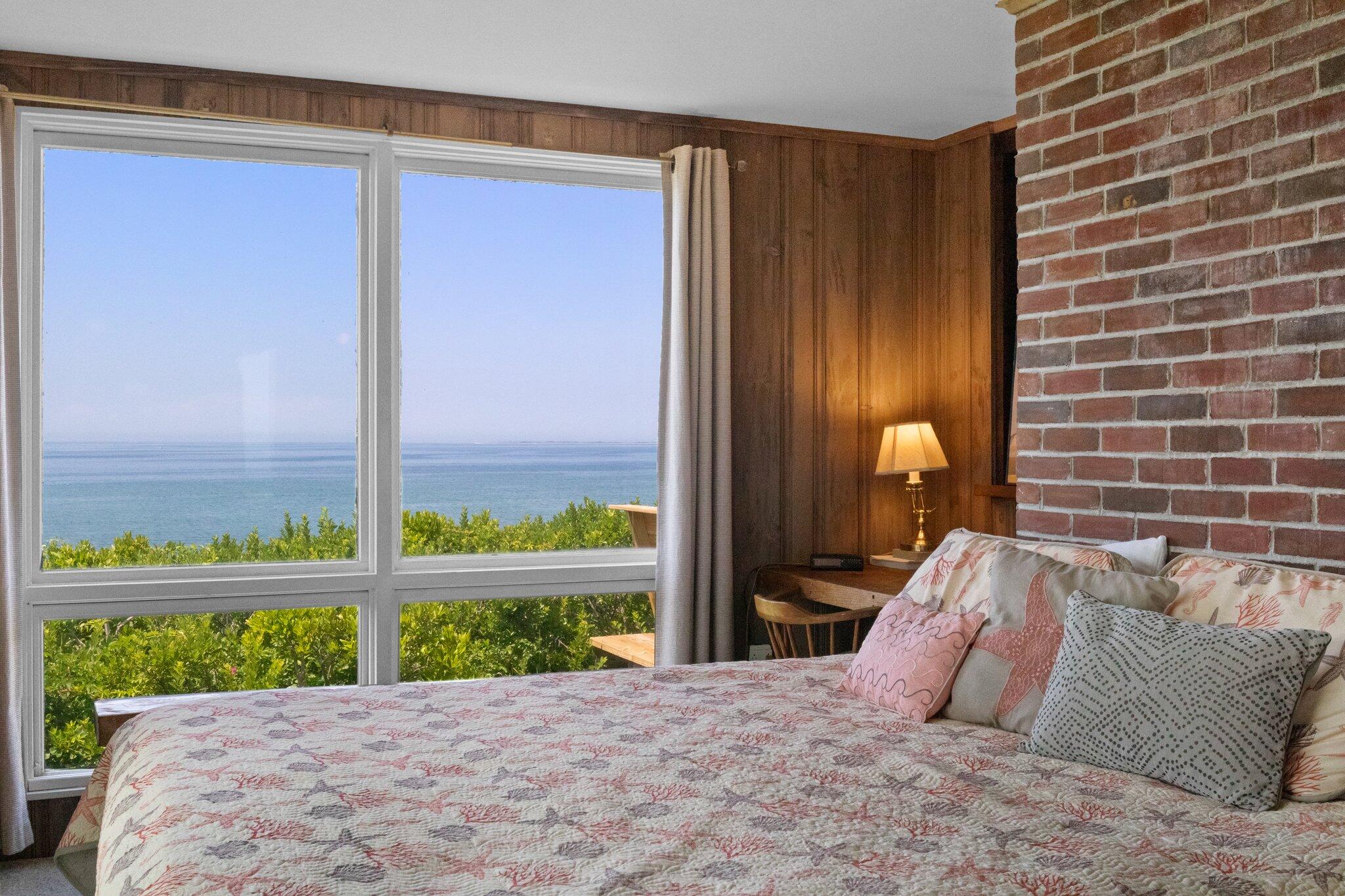 4 Bay View Path Truro, MA 02666 - Photo 17 of 71 a bed sitting in a bedroom next to a window