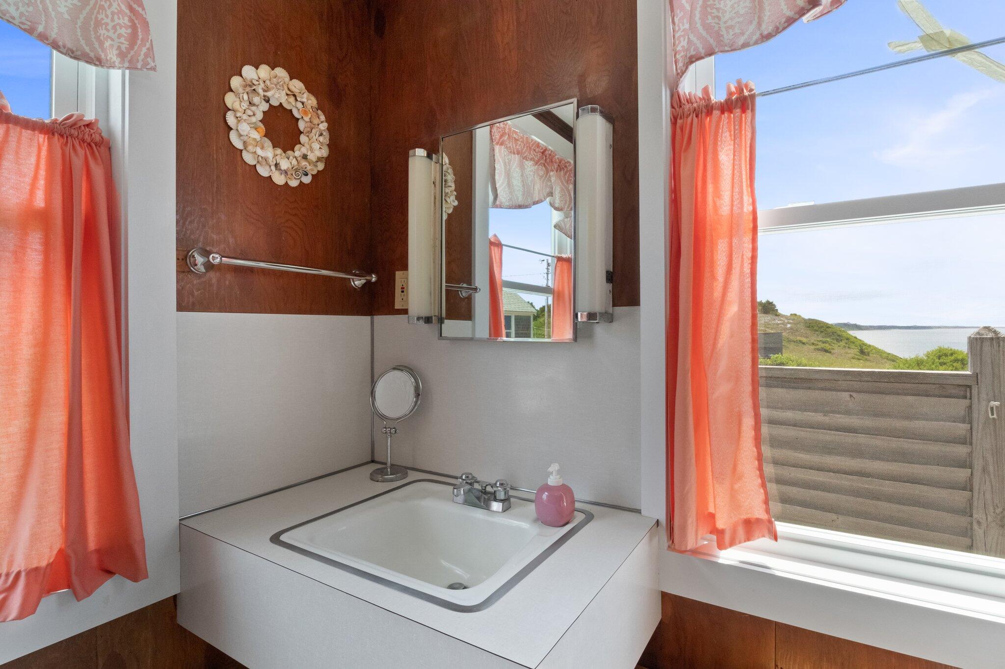 4 Bay View Path Truro, MA 02666 - Photo 19 of 71 a bathroom with a sink and a window