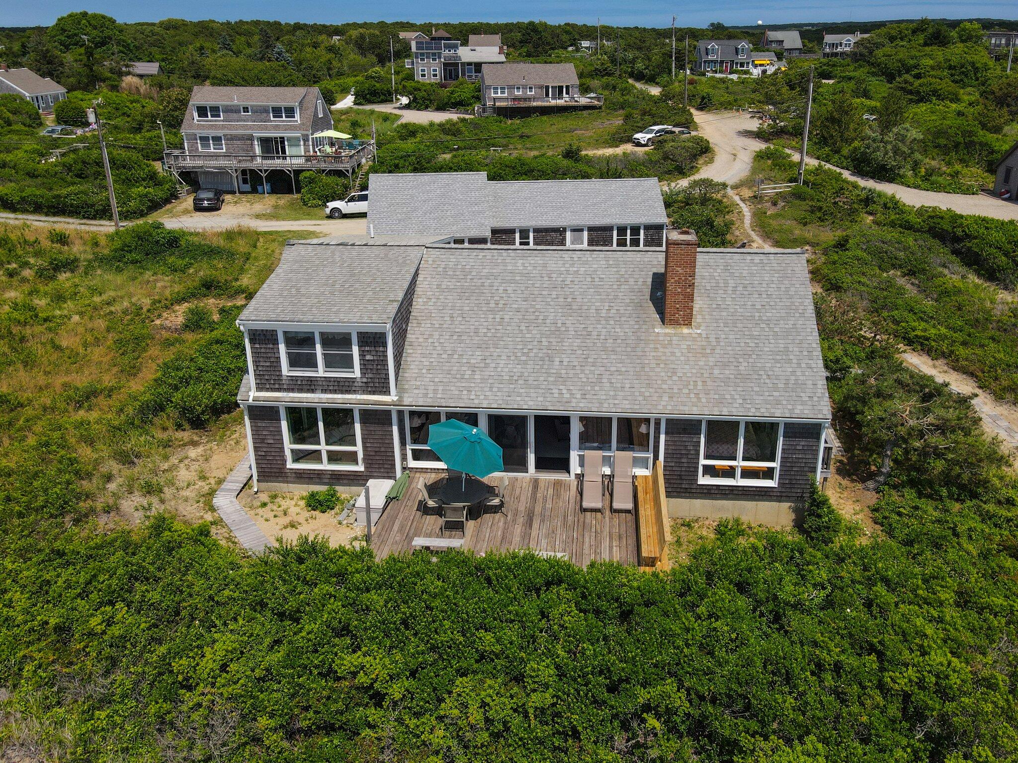 4 Bay View Path Truro, MA 02666 - Photo 2 of 71 an aerial view of a house with garden space and lake view