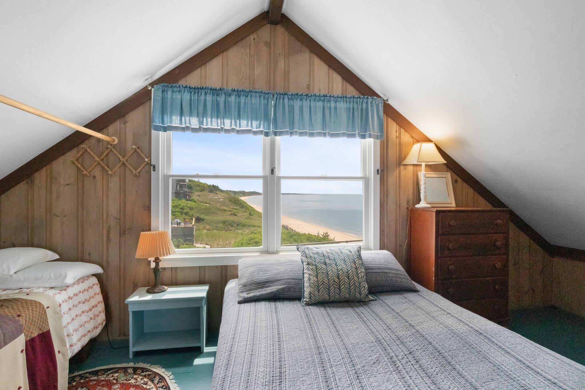 4 Bay View Path Truro, MA 02666 - Photo 28 of 71 a bedroom with a bed and a large window with wooden floor