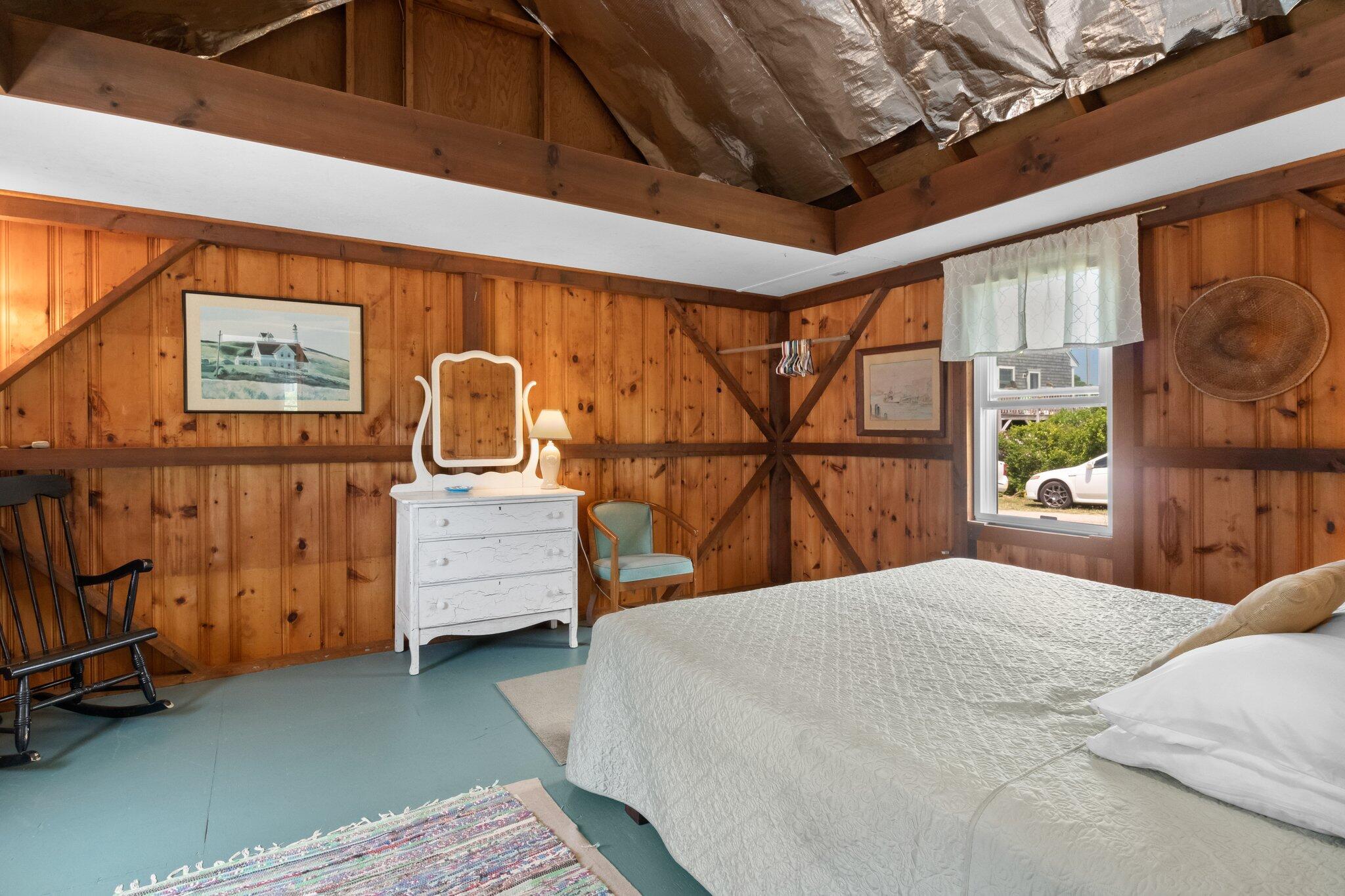 4 Bay View Path Truro, MA 02666 - Photo 38 of 71 a bedroom with a bed a dresser next to a window