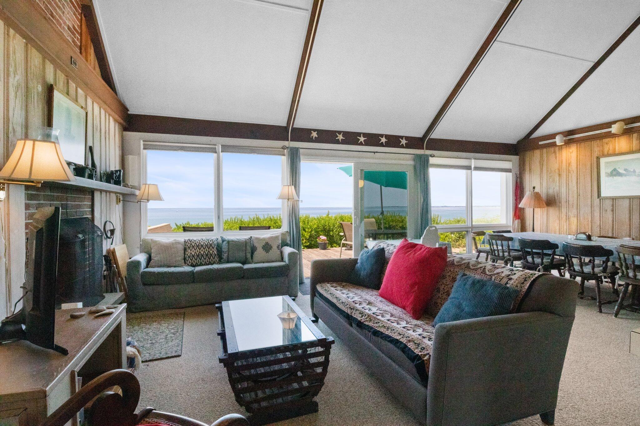 4 Bay View Path Truro, MA 02666 - Photo 4 of 71 a living room with furniture fireplace and a large window
