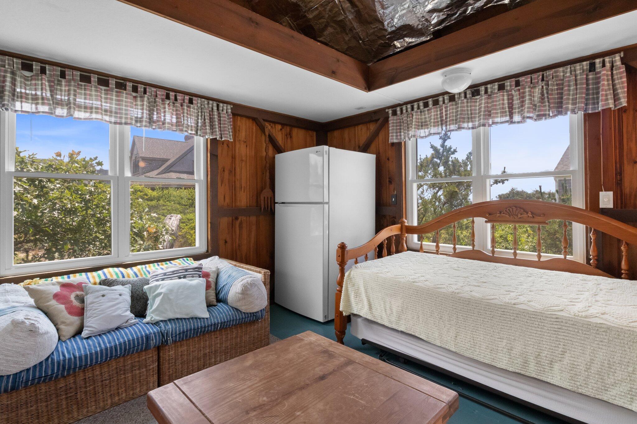 4 Bay View Path Truro, MA 02666 - Photo 42 of 71 a bedroom with a bed couch and a large window