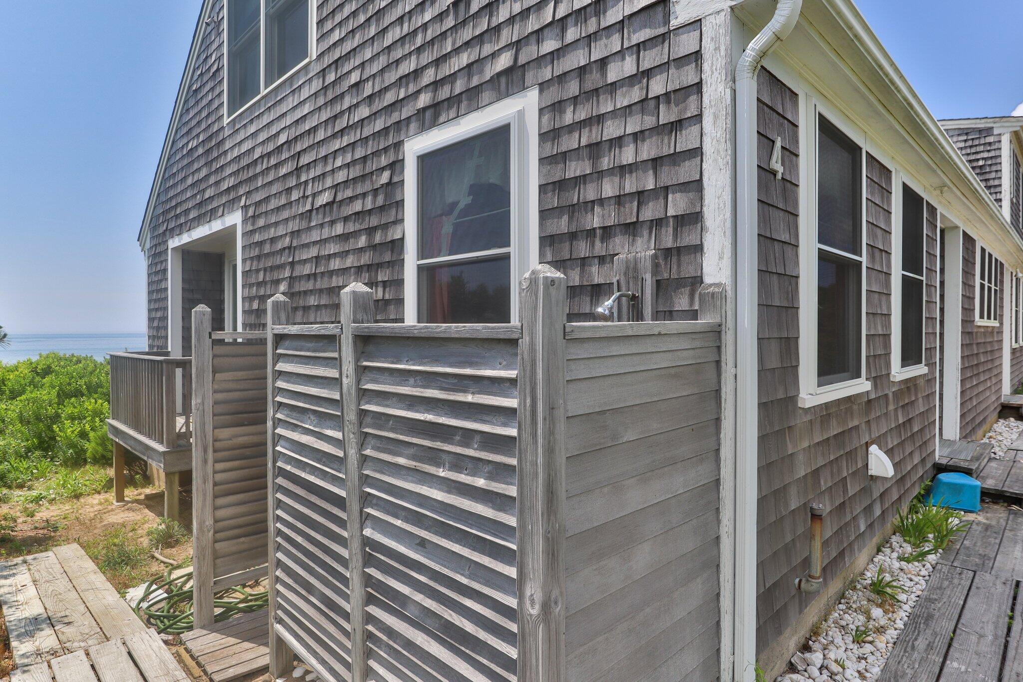 4 Bay View Path Truro, MA 02666 - Photo 47 of 71 a view of a brick building with many windows