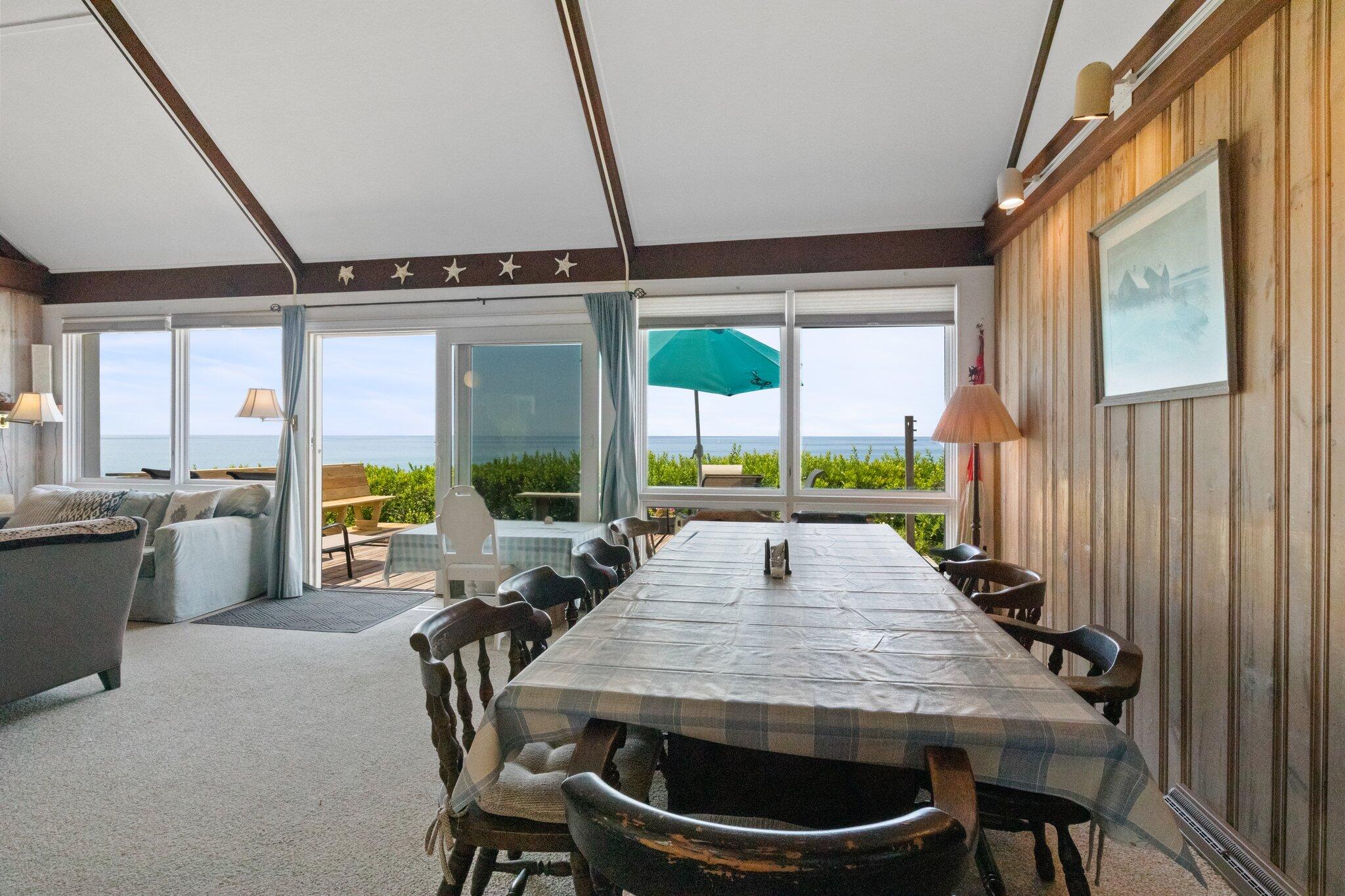 4 Bay View Path Truro, MA 02666 - Photo 6 of 71 a view of a patio with a table chairs and a grill