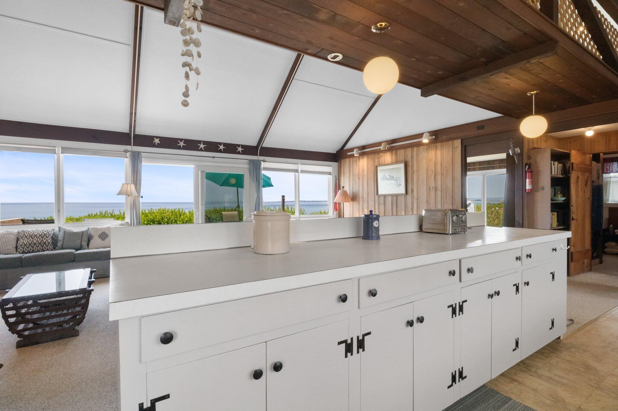 4 Bay View Path Truro, MA 02666 - Photo 9 of 71 a kitchen with counter top space and stainless steel appliances