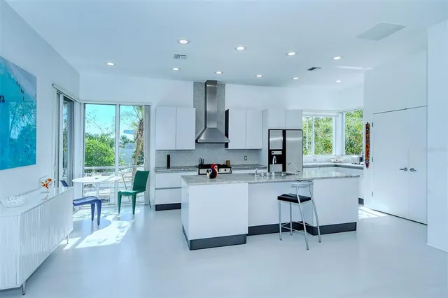 a view of a porch with furniture and a yard