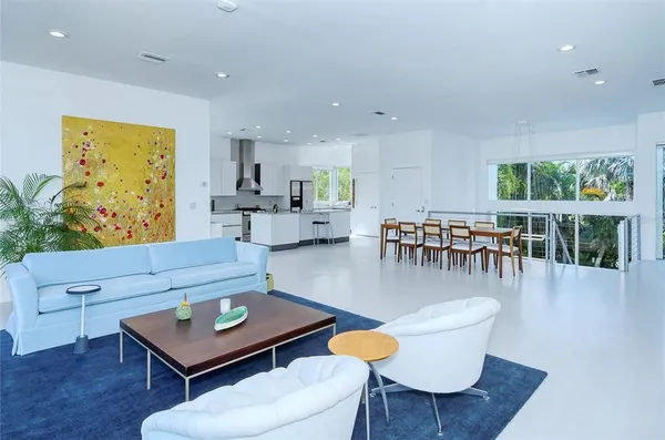 a living room with furniture and flat screen tv