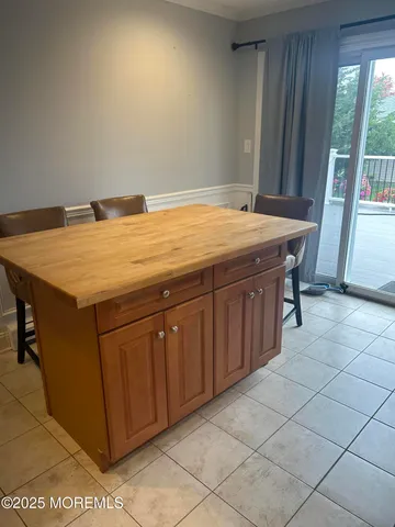 a room with a table and chairs