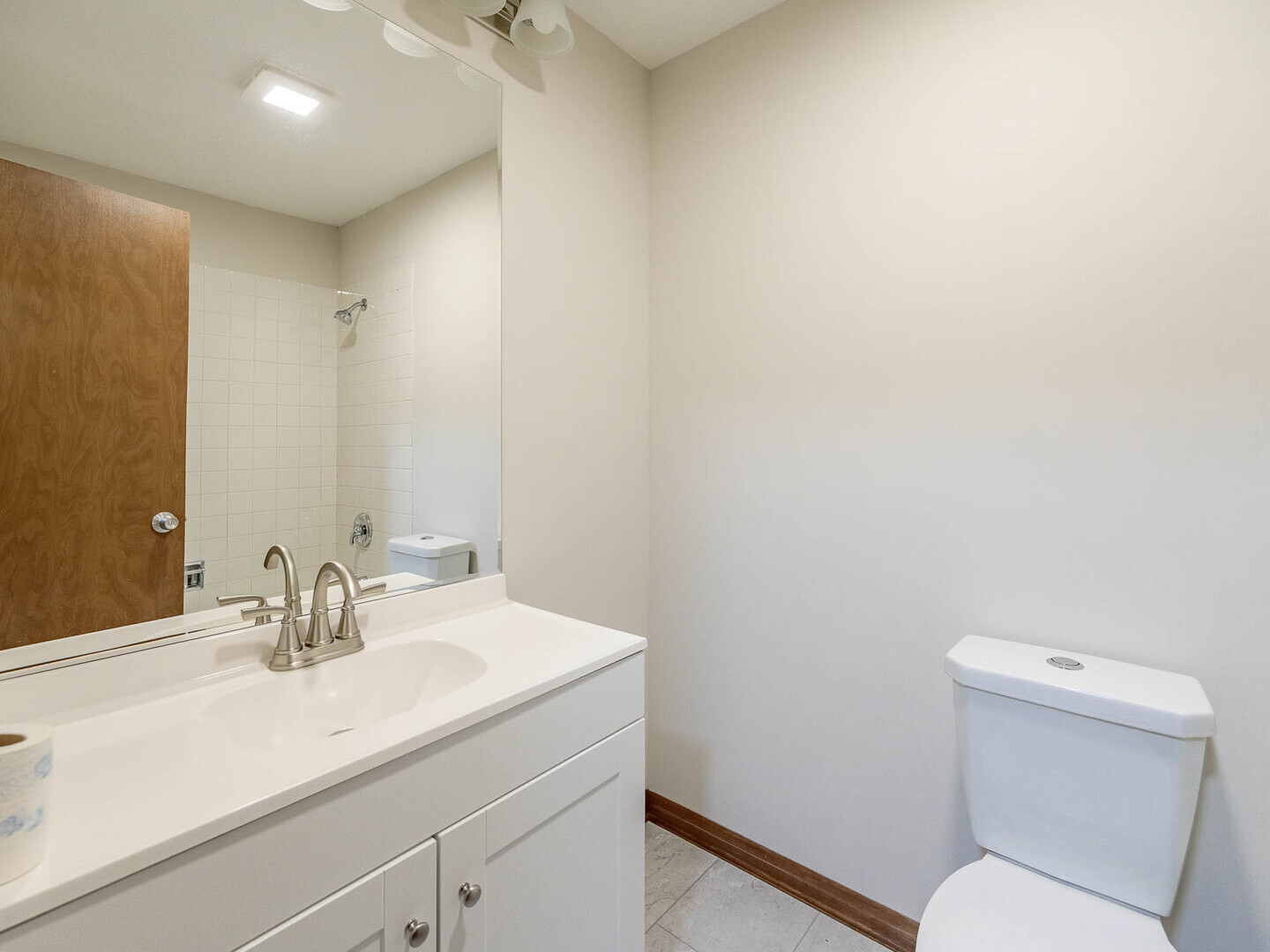19211 Elm Drive, Unit 145 Country Club Hills, IL 60478 - Photo 11 of 16 a bathroom with a sink a toilet and a mirror