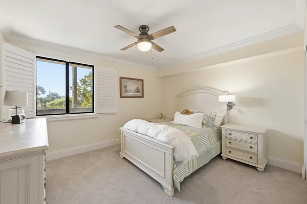 a room with a bed and a chandelier