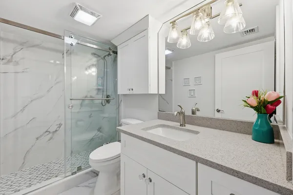 a view of a hallway with washer and dryer