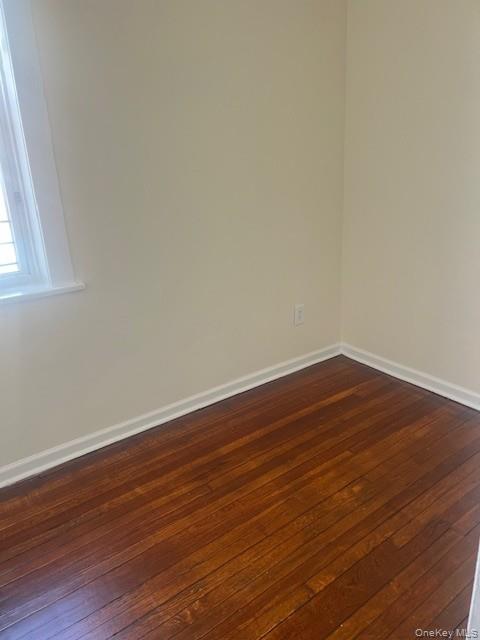 169 Tibbetts Road, Unit 1 Yonkers, NY 10705 - Photo 11 of 17 a view of an empty room with wooden floor and a window