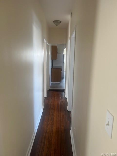 169 Tibbetts Road, Unit 1 Yonkers, NY 10705 - Photo 15 of 17 a view of a hallway with wooden floor and a bathroom