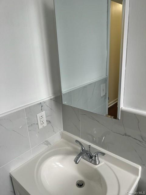 169 Tibbetts Road, Unit 1 Yonkers, NY 10705 - Photo 6 of 17 a bathroom with a sink and a mirror
