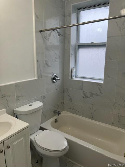 169 Tibbetts Road, Unit 1 Yonkers, NY 10705 - Photo 7 of 17 a bathroom with a sink a toilet and a bathtub