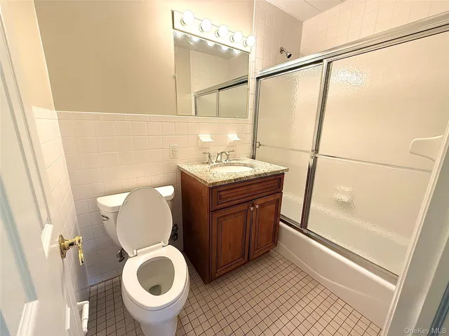 a bathroom with a toilet a sink and a shower