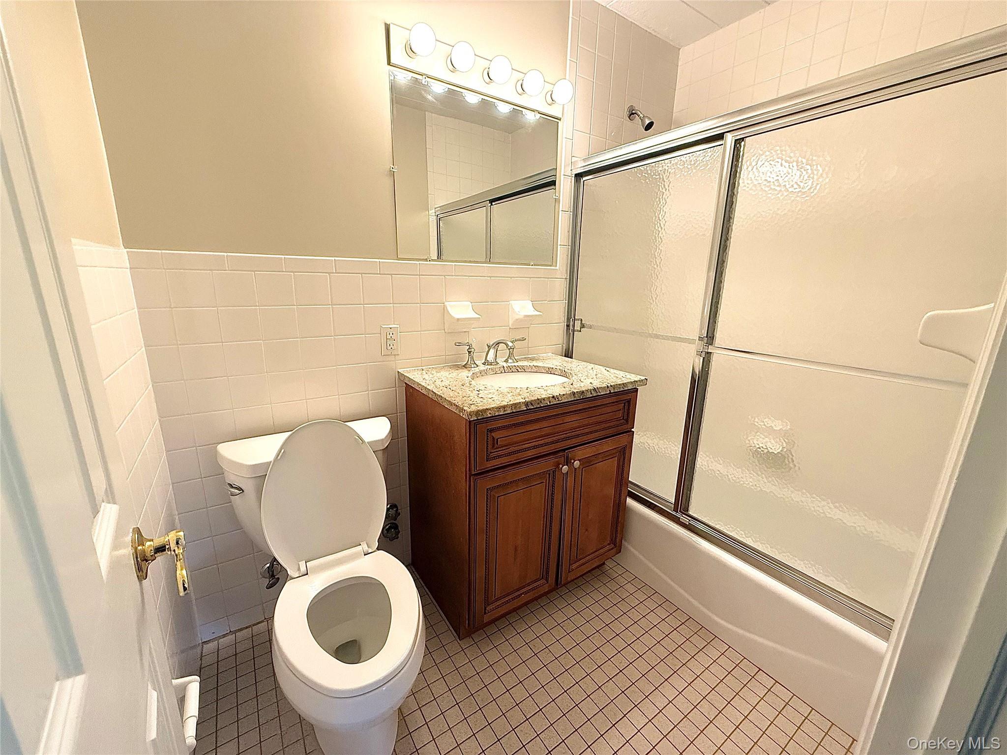 505 White Plains Road, Unit 2G Eastchester, NY 10709 - Photo 11 of 11 a bathroom with a toilet a sink and a shower