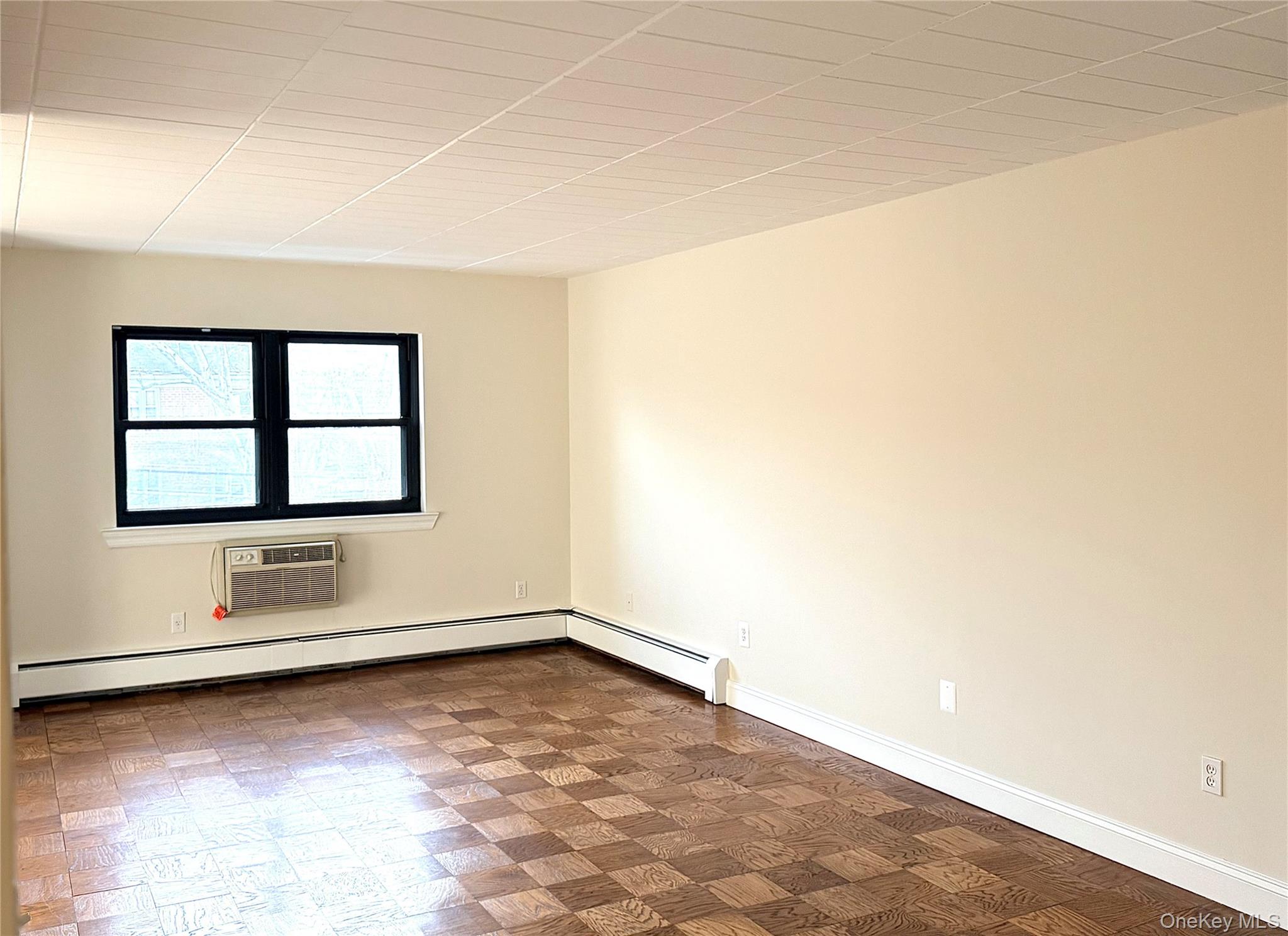 505 White Plains Road, Unit 2G Eastchester, NY 10709 - Photo 5 of 11 an empty room with windows