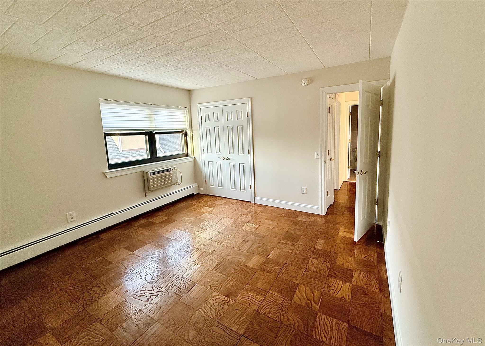 505 White Plains Road, Unit 2G Eastchester, NY 10709 - Photo 9 of 11 a view of empty room with kitchen and window