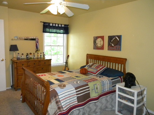 679 Bayfield Road Rockton, IL 61073 - Photo 12 of 21 a bedroom with a bed and a table in it