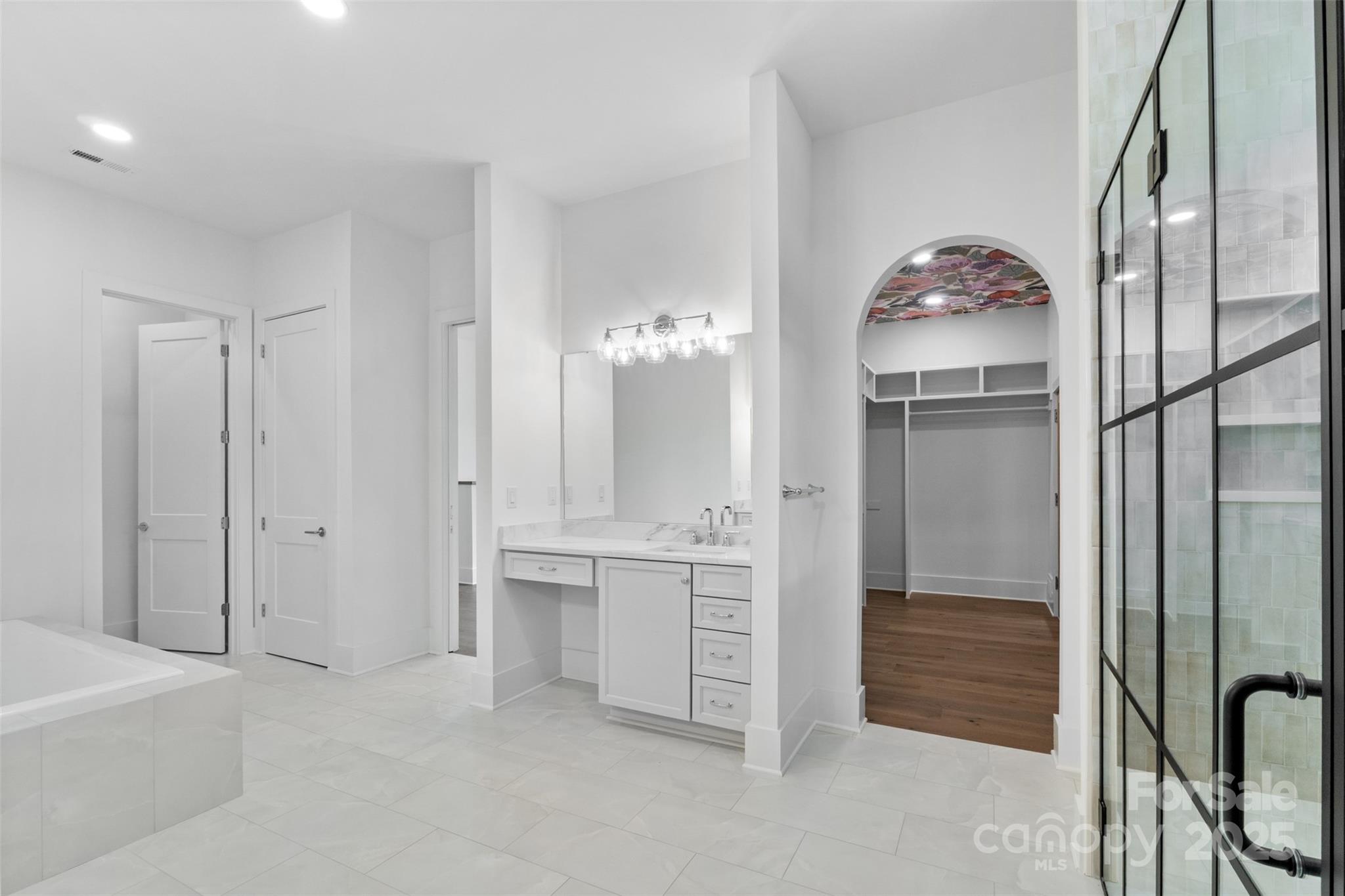 2296 Bridgewater Road, Unit 2 Rock Hill, SC 29730 - Photo 15 of 31 a bathroom with a double vanity sink a large mirror and a bathtub