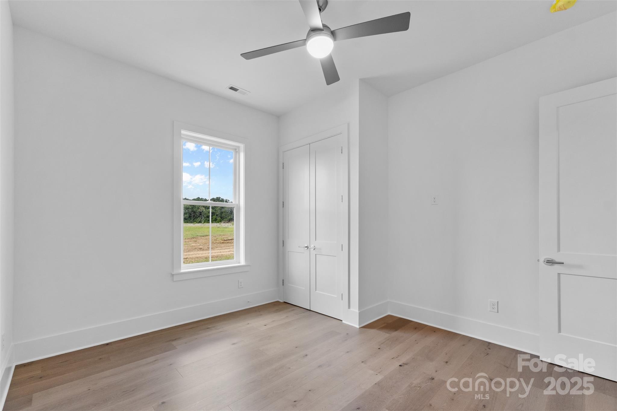 2296 Bridgewater Road, Unit 2 Rock Hill, SC 29730 - Photo 20 of 31 an empty room with windows and fan