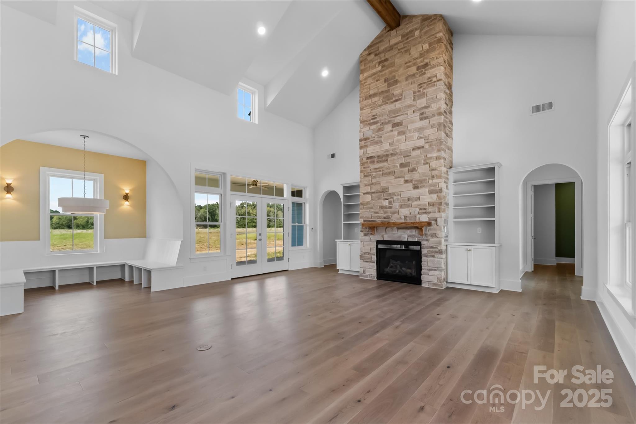 2296 Bridgewater Road, Unit 2 Rock Hill, SC 29730 - Photo 2 of 31 an empty room with fireplace wooden floor and windows