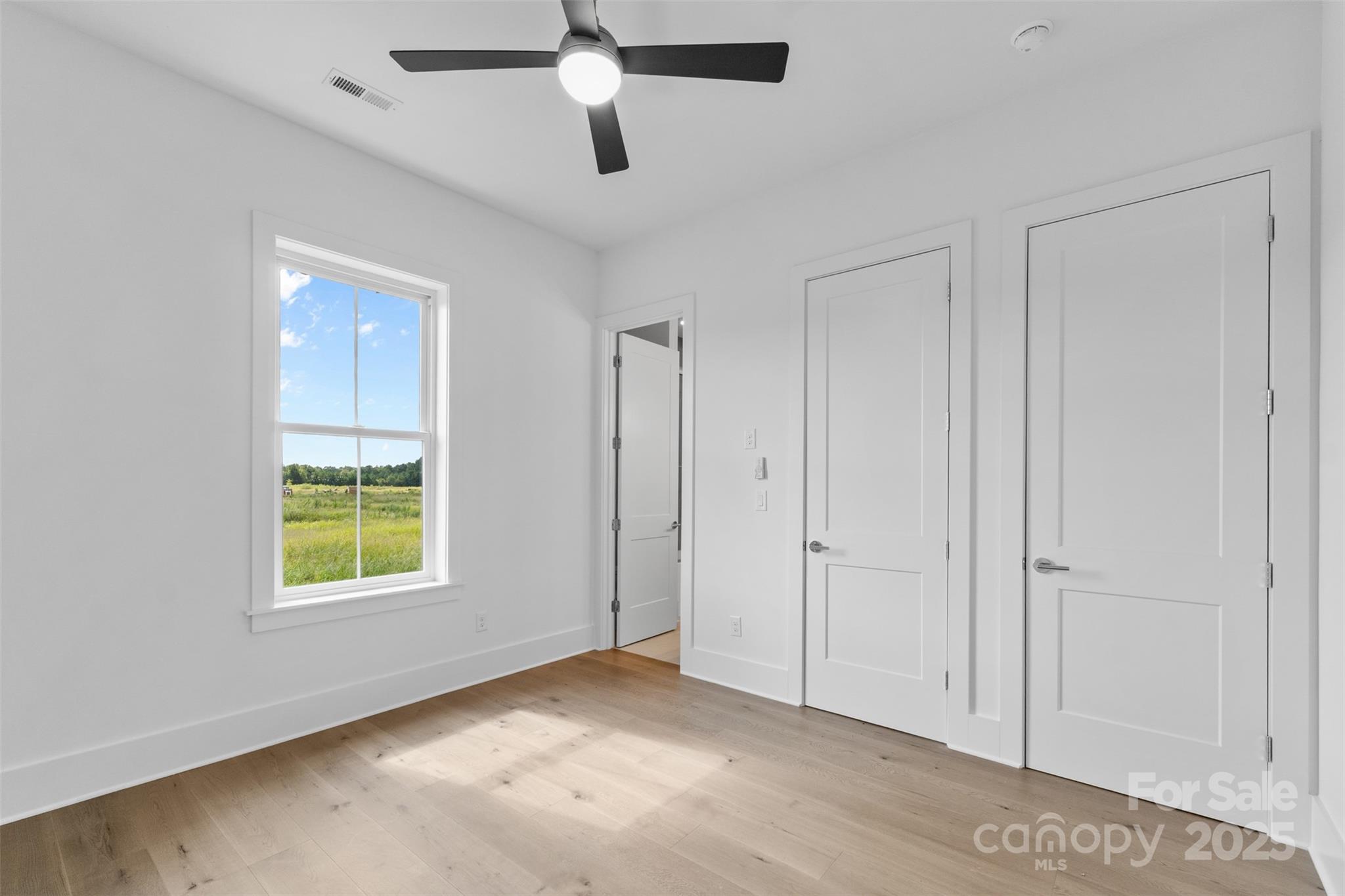 2296 Bridgewater Road, Unit 2 Rock Hill, SC 29730 - Photo 24 of 31 wooden floor in an empty room with a window