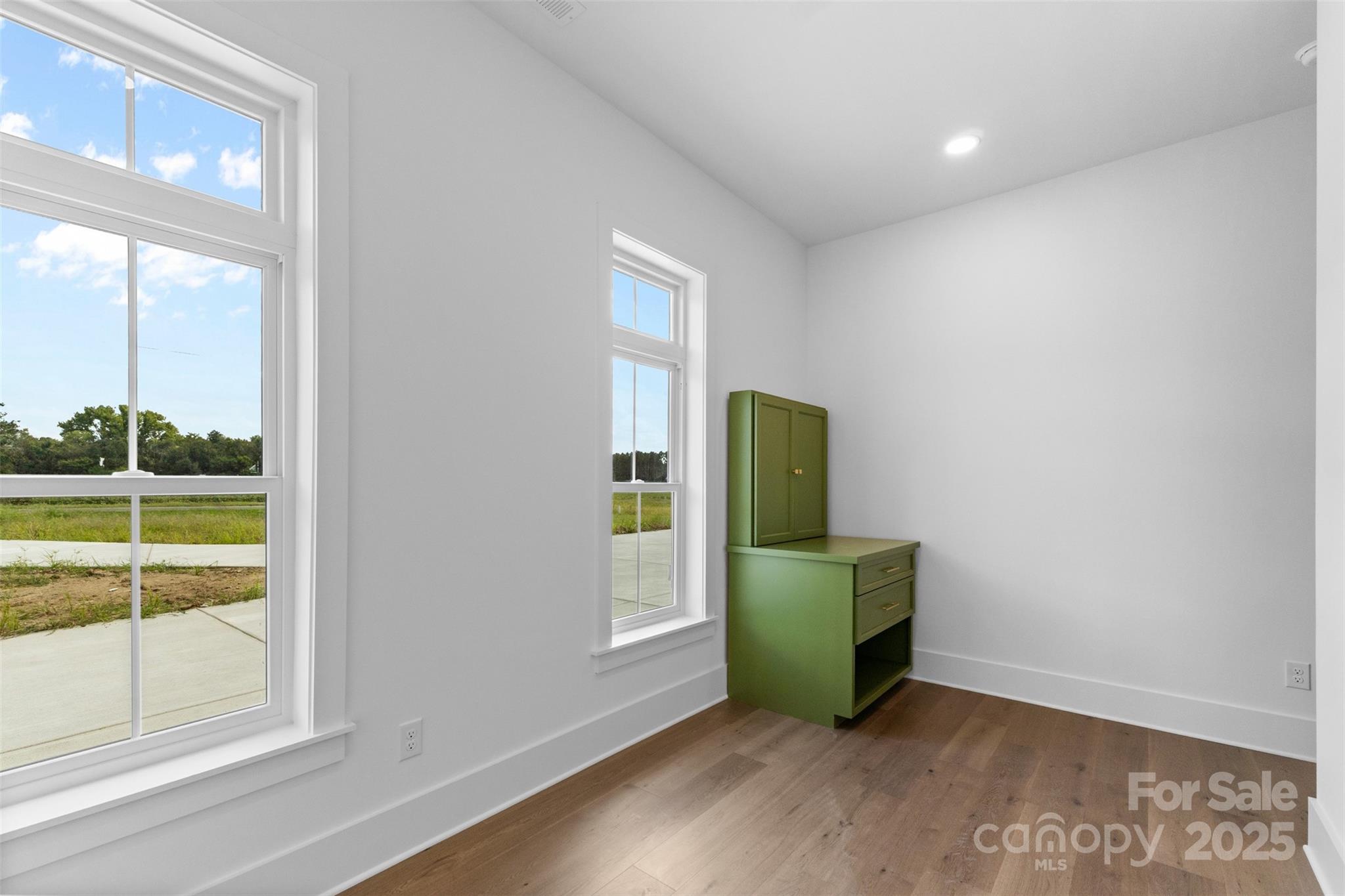 2296 Bridgewater Road, Unit 2 Rock Hill, SC 29730 - Photo 28 of 31 an empty room with wooden floor and a window