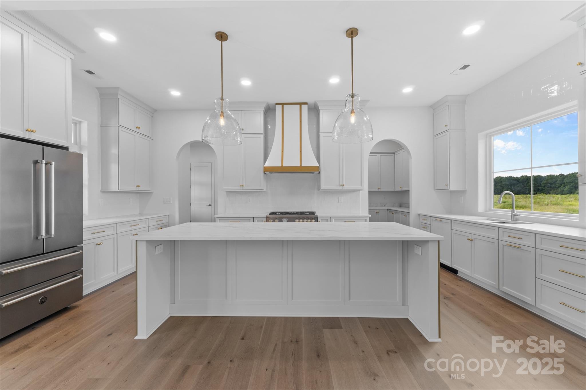 2296 Bridgewater Road, Unit 2 Rock Hill, SC 29730 - Photo 6 of 31 a large kitchen with kitchen island white cabinets and stainless steel appliances