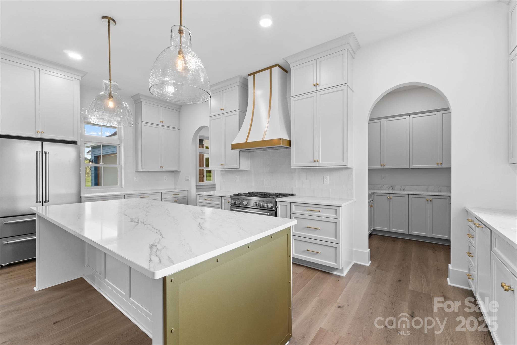 2296 Bridgewater Road, Unit 2 Rock Hill, SC 29730 - Photo 7 of 31 a kitchen with stainless steel appliances granite countertop a sink a stove a refrigerator and island with wooden floor