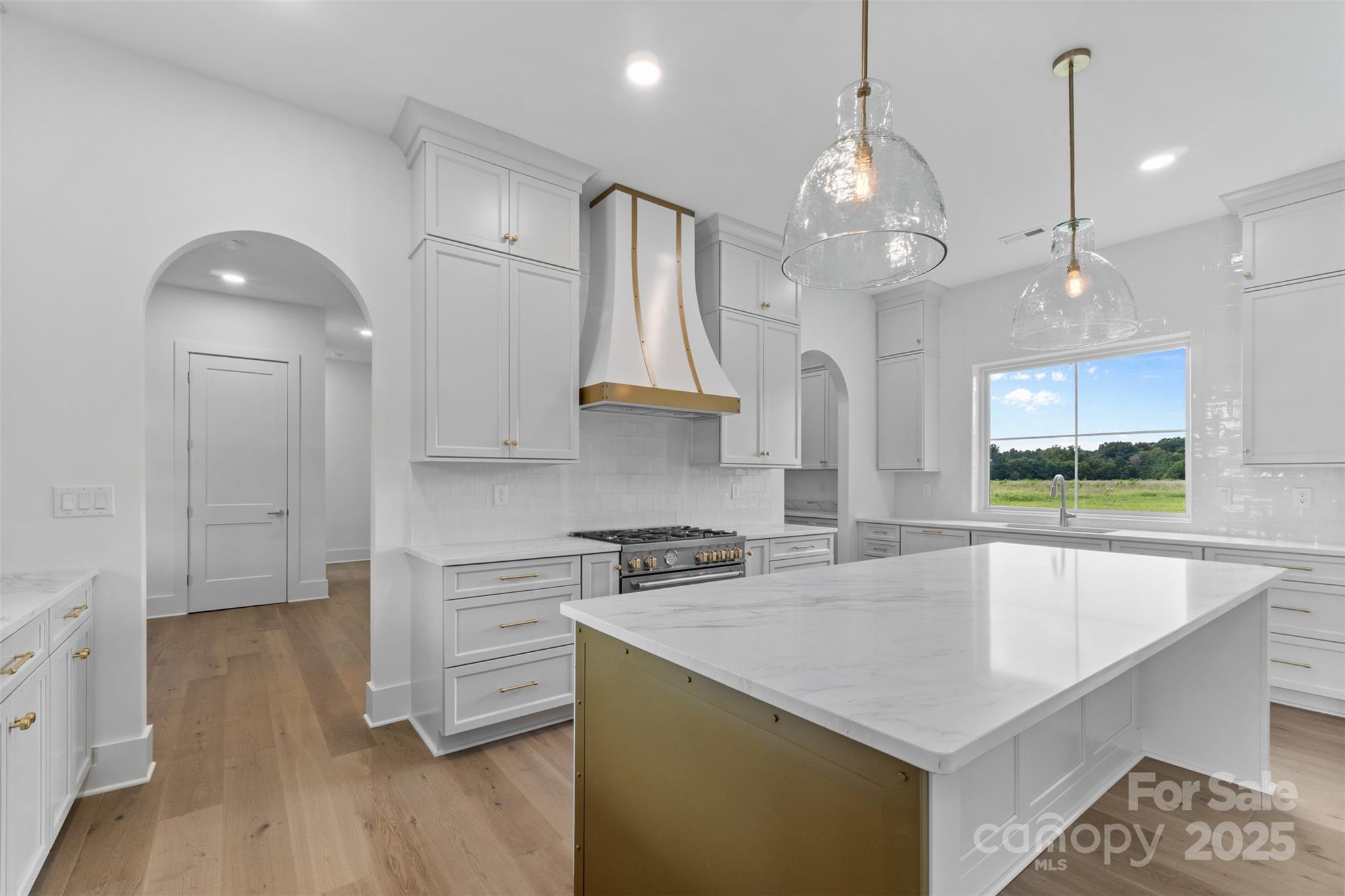 2296 Bridgewater Road, Unit 2 Rock Hill, SC 29730 - Photo 8 of 31 a kitchen that has a lot of cabinets and wooden floor