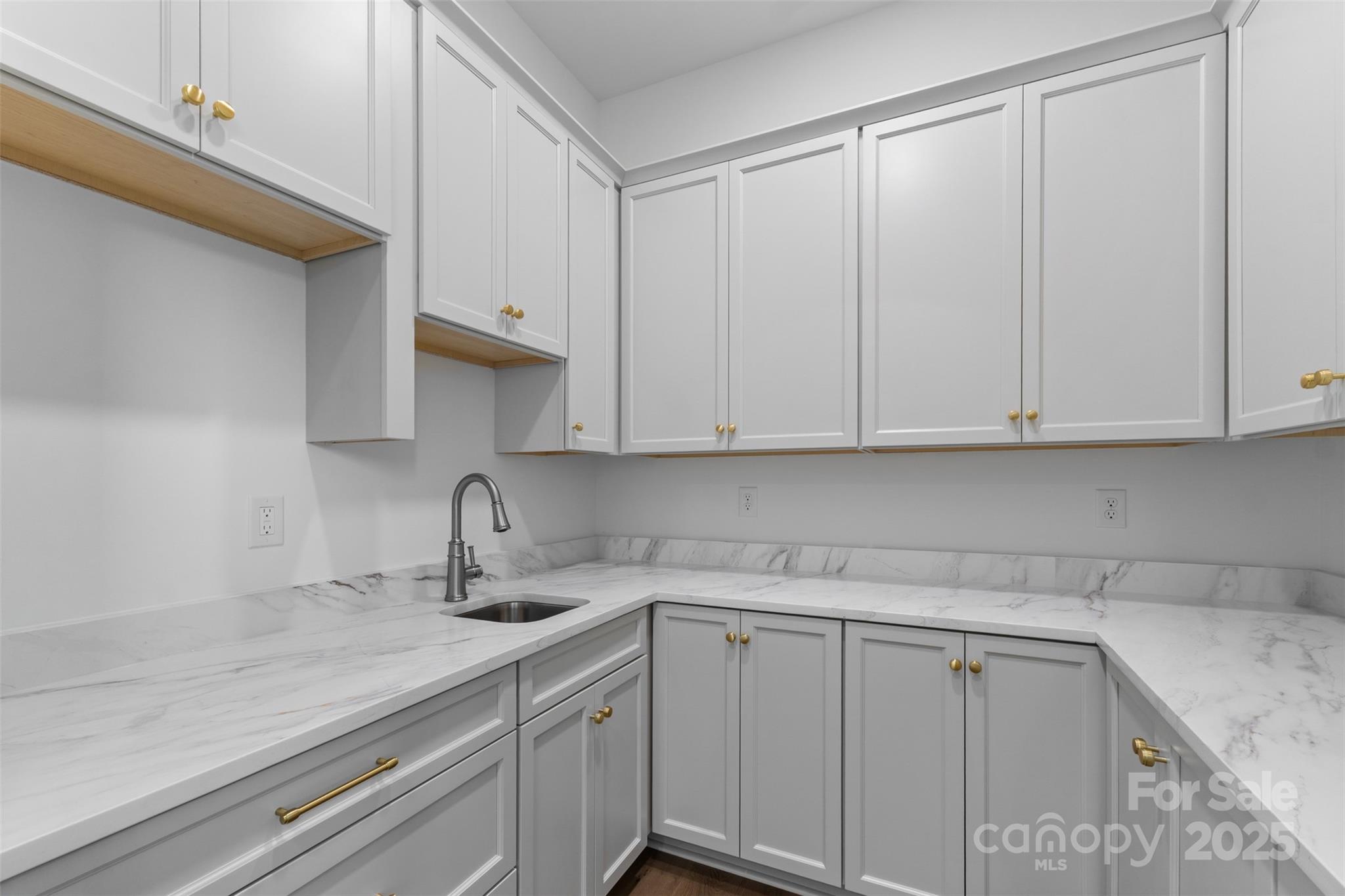 2296 Bridgewater Road, Unit 2 Rock Hill, SC 29730 - Photo 9 of 31 a kitchen with white cabinets and a sink