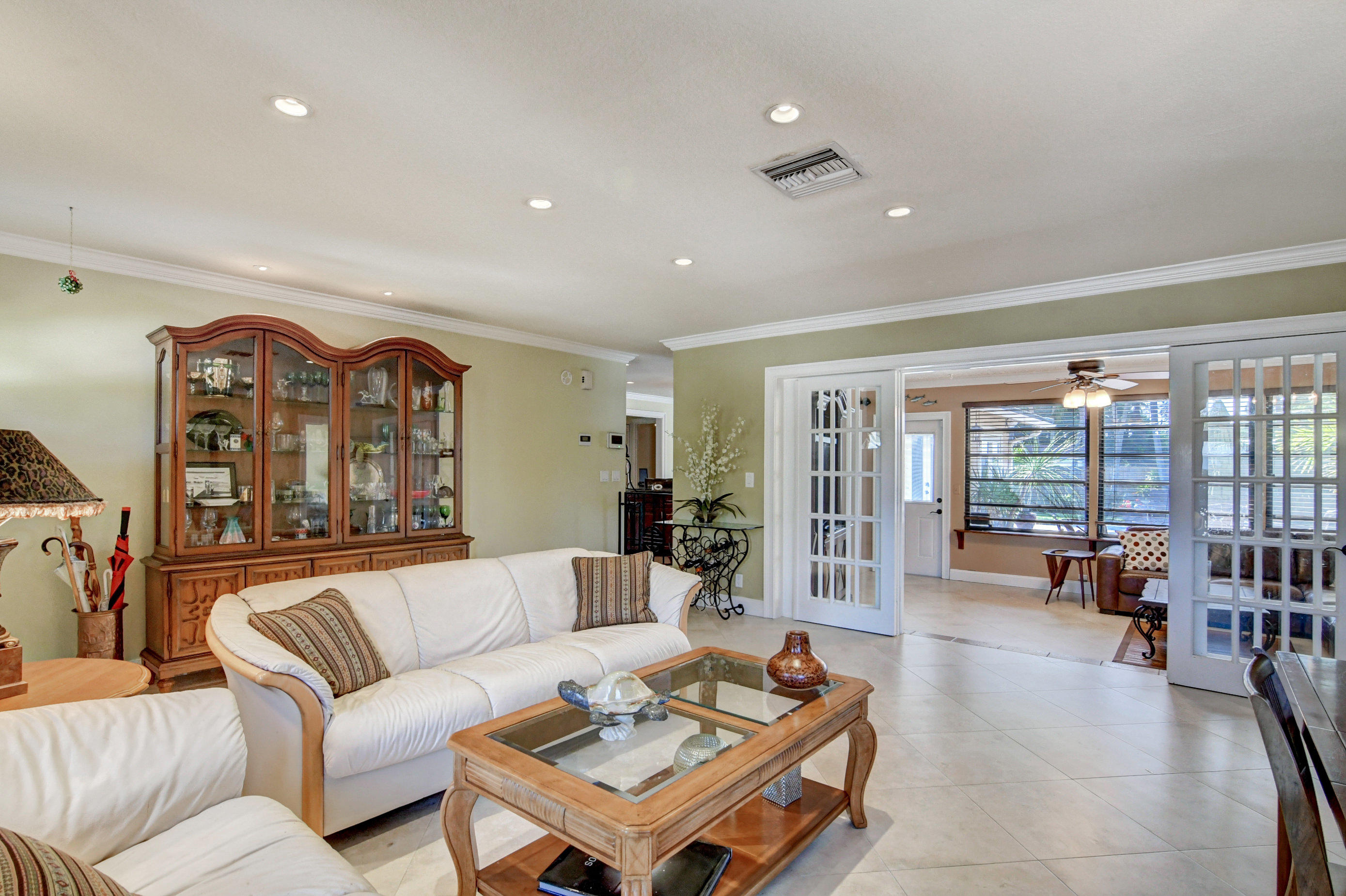 1720 Southwest 9th Street Boca Raton, FL 33486 - Photo 13 of 75 a living room with furniture and a large window