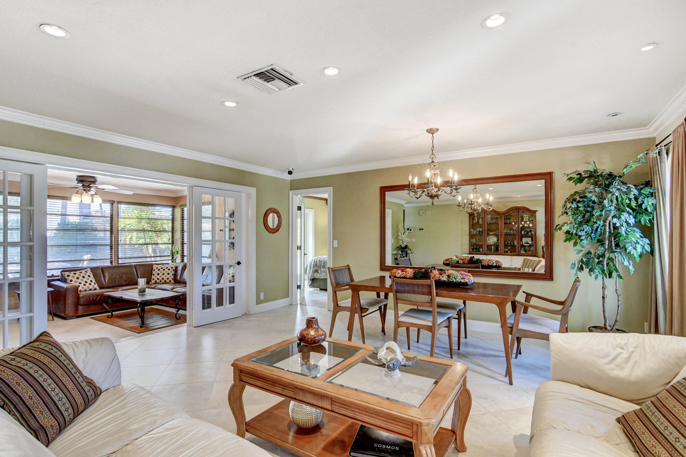 1720 Southwest 9th Street Boca Raton, FL 33486 - Photo 15 of 75 a living room with furniture a table and a large window