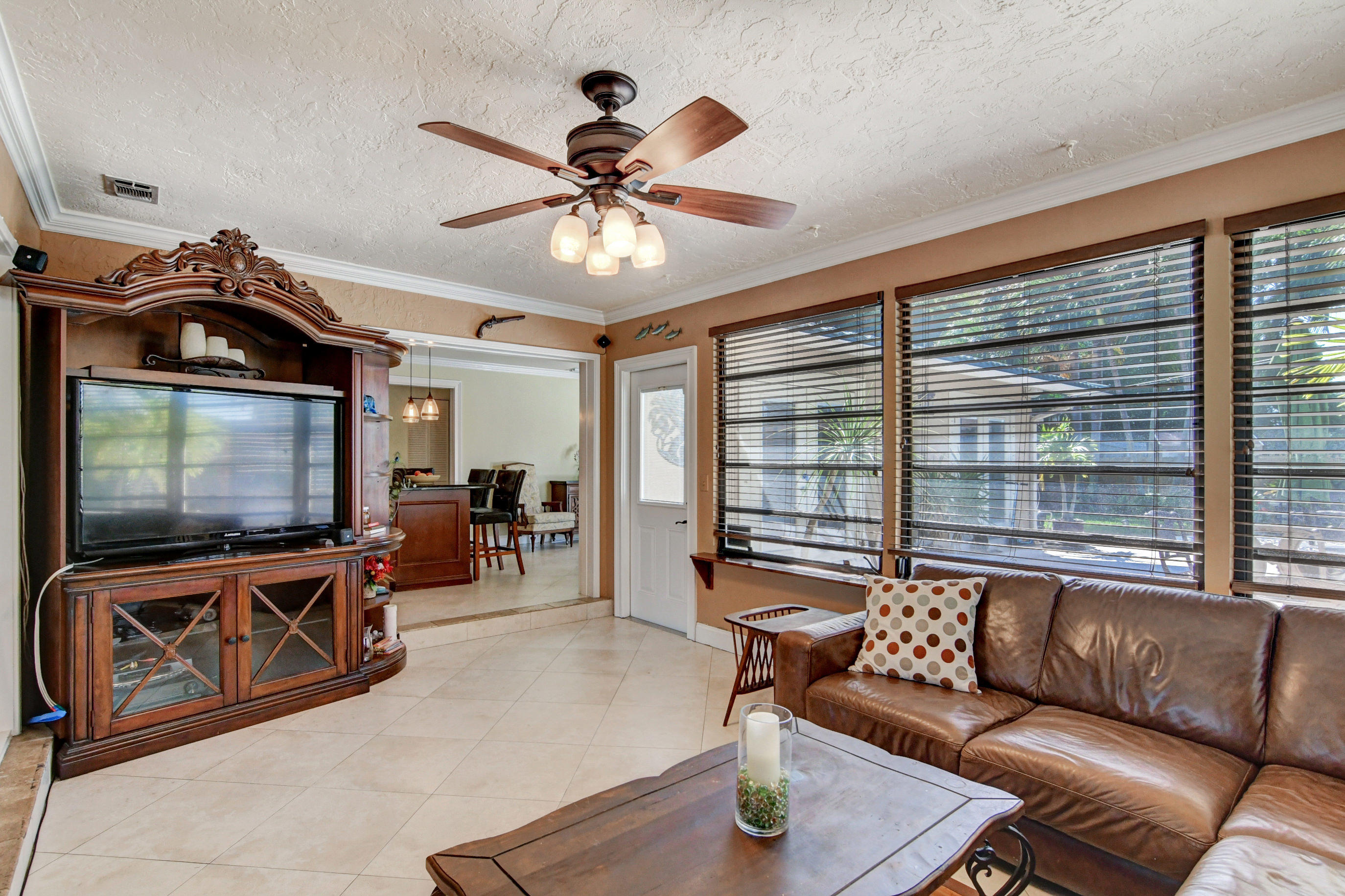 1720 Southwest 9th Street Boca Raton, FL 33486 - Photo 17 of 75 a living room with furniture and a flat screen tv