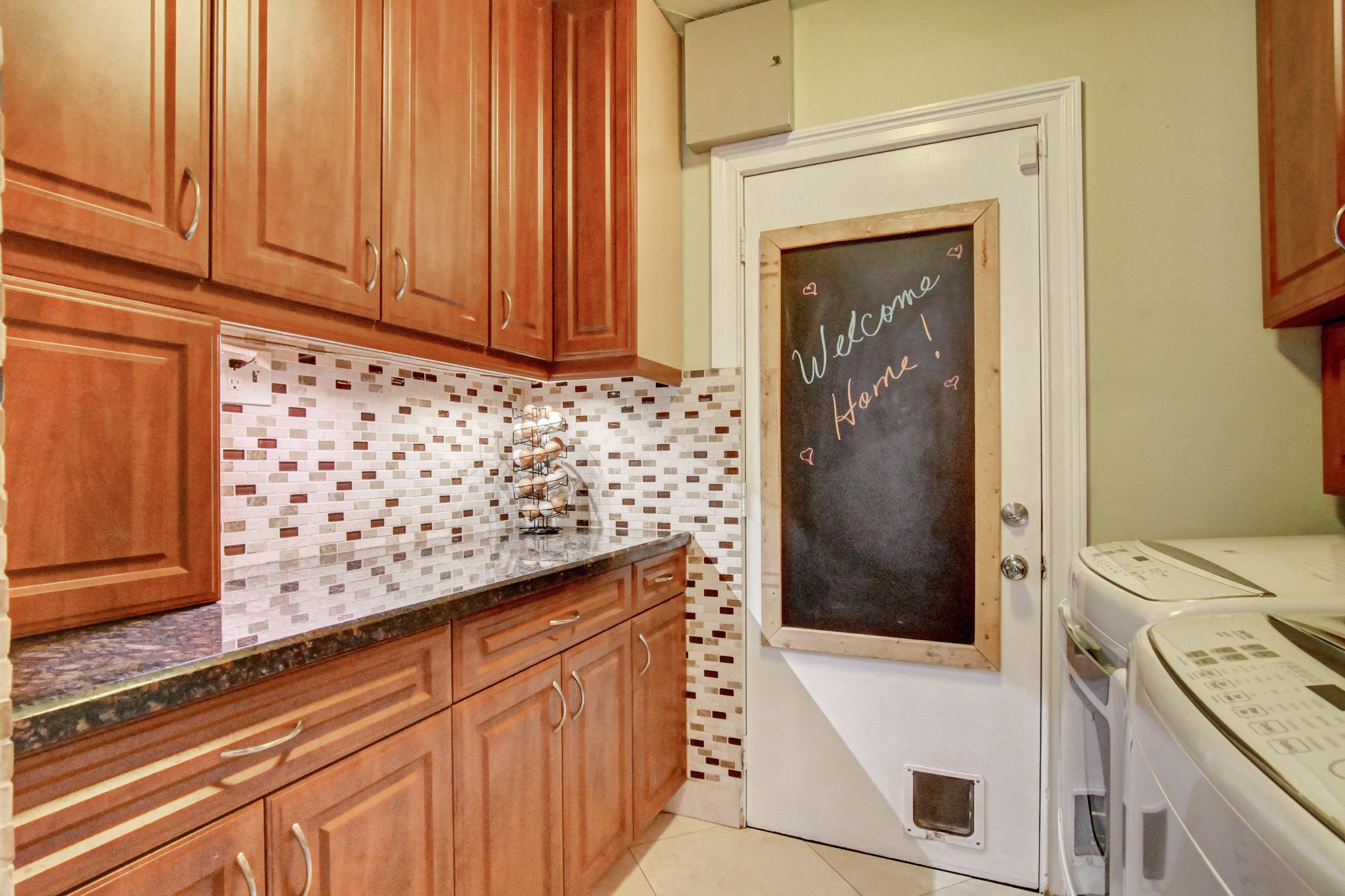 1720 Southwest 9th Street Boca Raton, FL 33486 - Photo 29 of 75 a bathroom with a granite countertop sink and a mirror