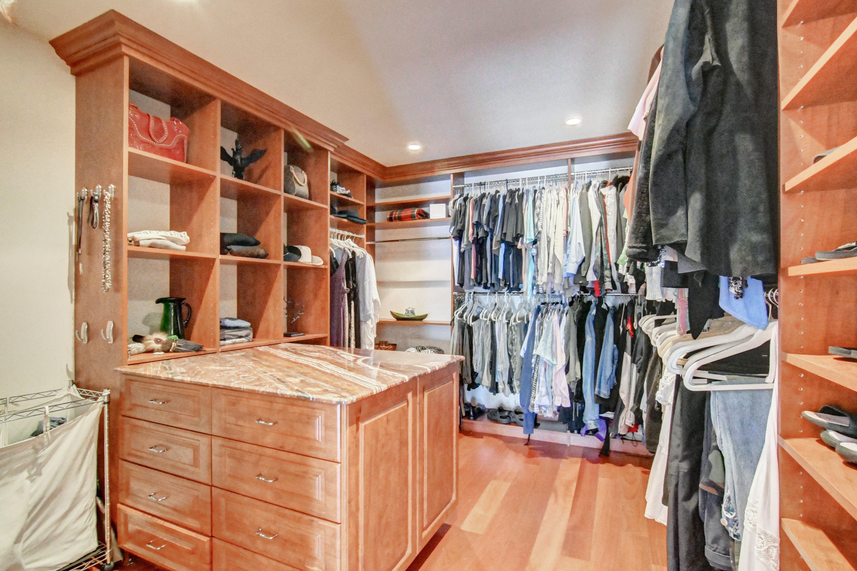 1720 Southwest 9th Street Boca Raton, FL 33486 - Photo 36 of 75 a view of walk in closet with clothes and shoes