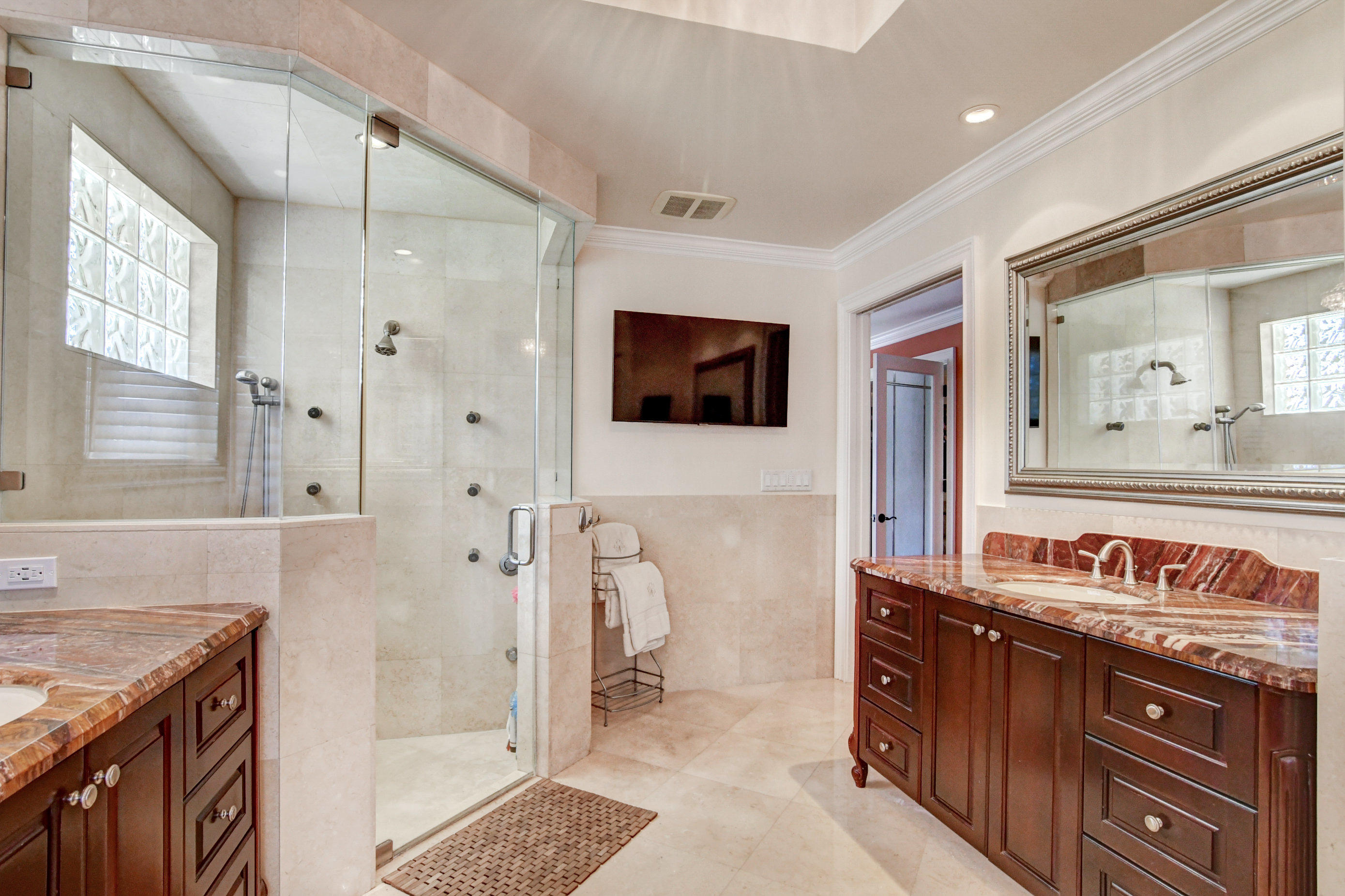 1720 Southwest 9th Street Boca Raton, FL 33486 - Photo 39 of 75 a bathroom with a granite countertop sink a mirror and a shower