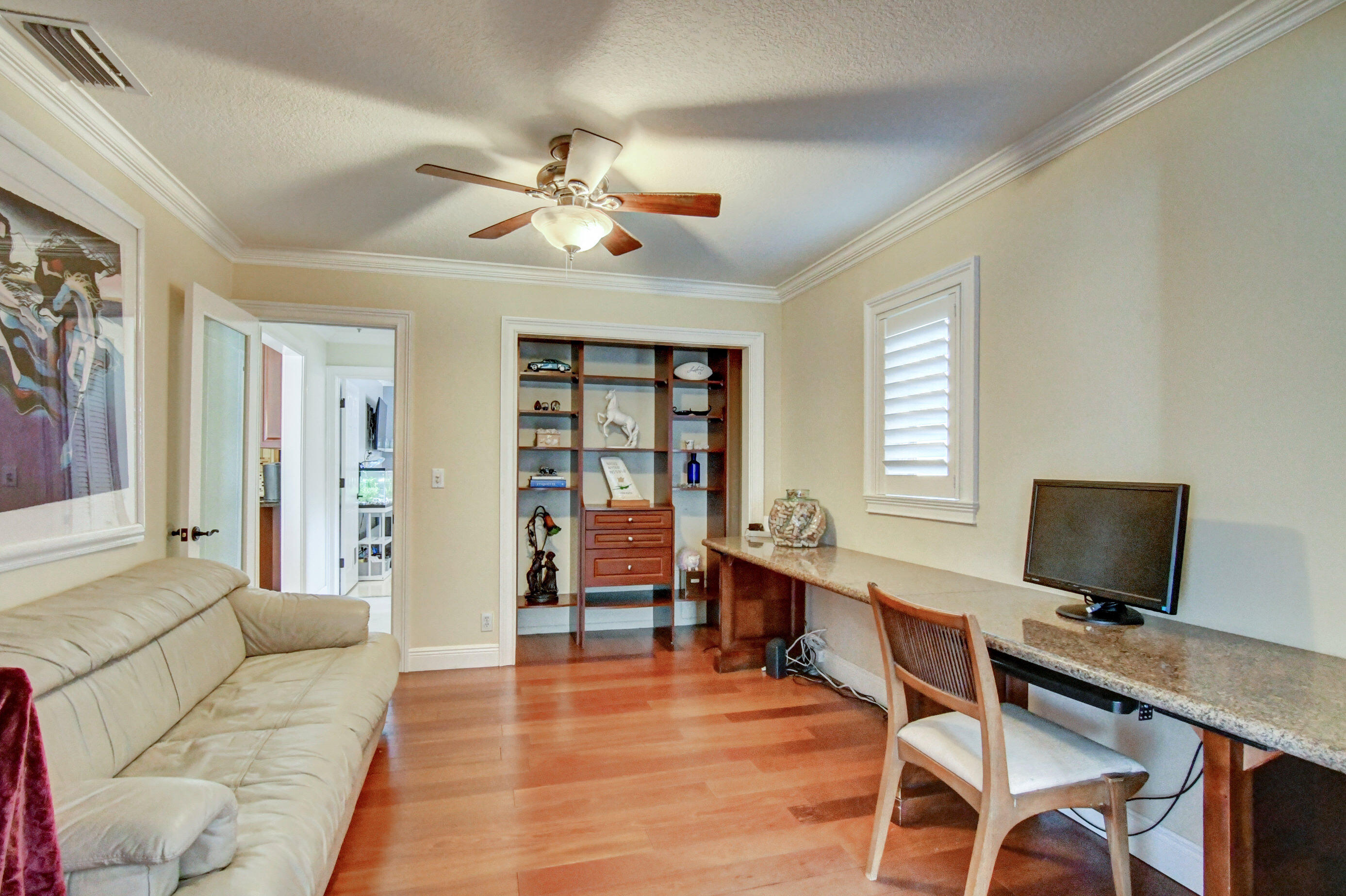 1720 Southwest 9th Street Boca Raton, FL 33486 - Photo 42 of 75 a view of a livingroom with workspace and a window