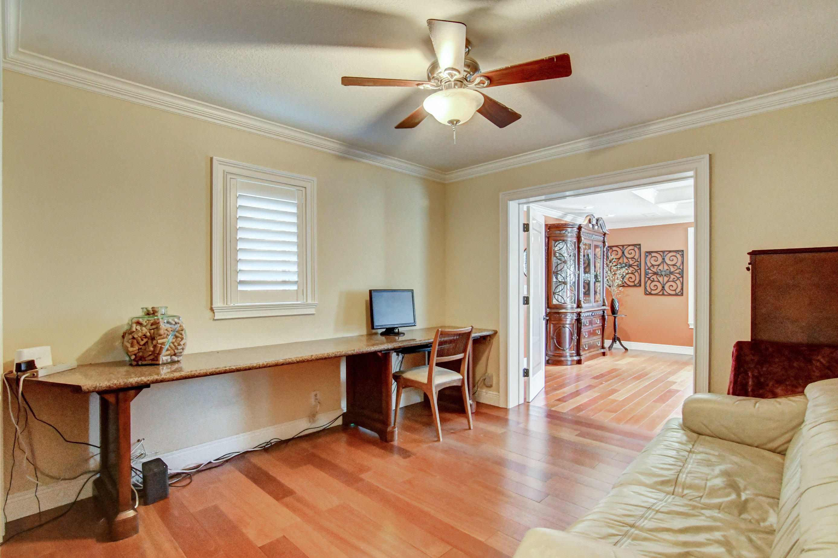1720 Southwest 9th Street Boca Raton, FL 33486 - Photo 43 of 75 a living room with furniture a dining table and a flat screen tv with wooden floor